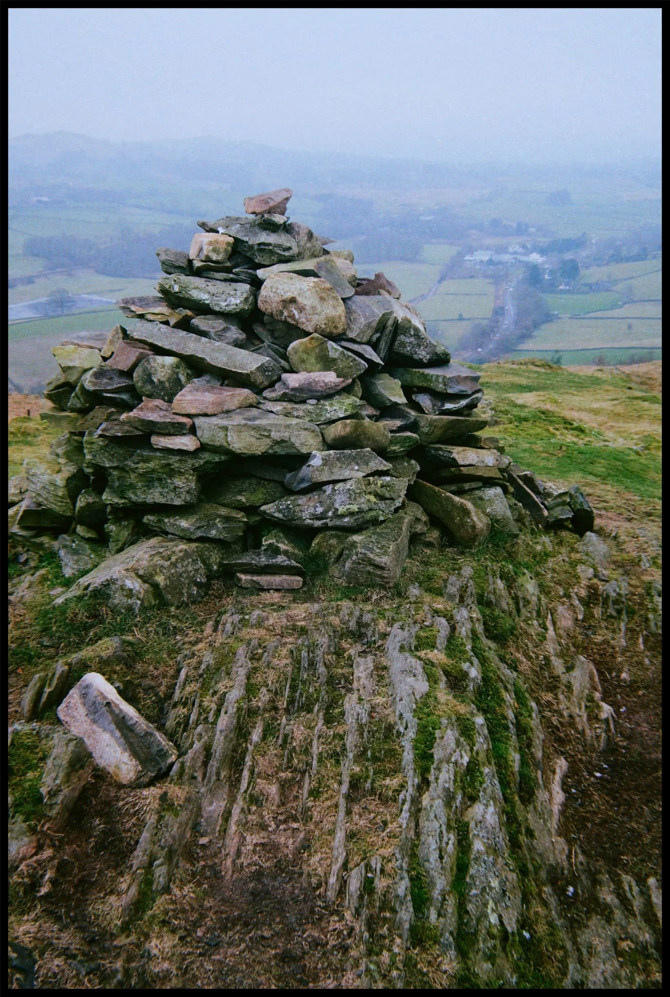 The summit cairn of Reston Scar, with the merest hint of Ings village below. 
