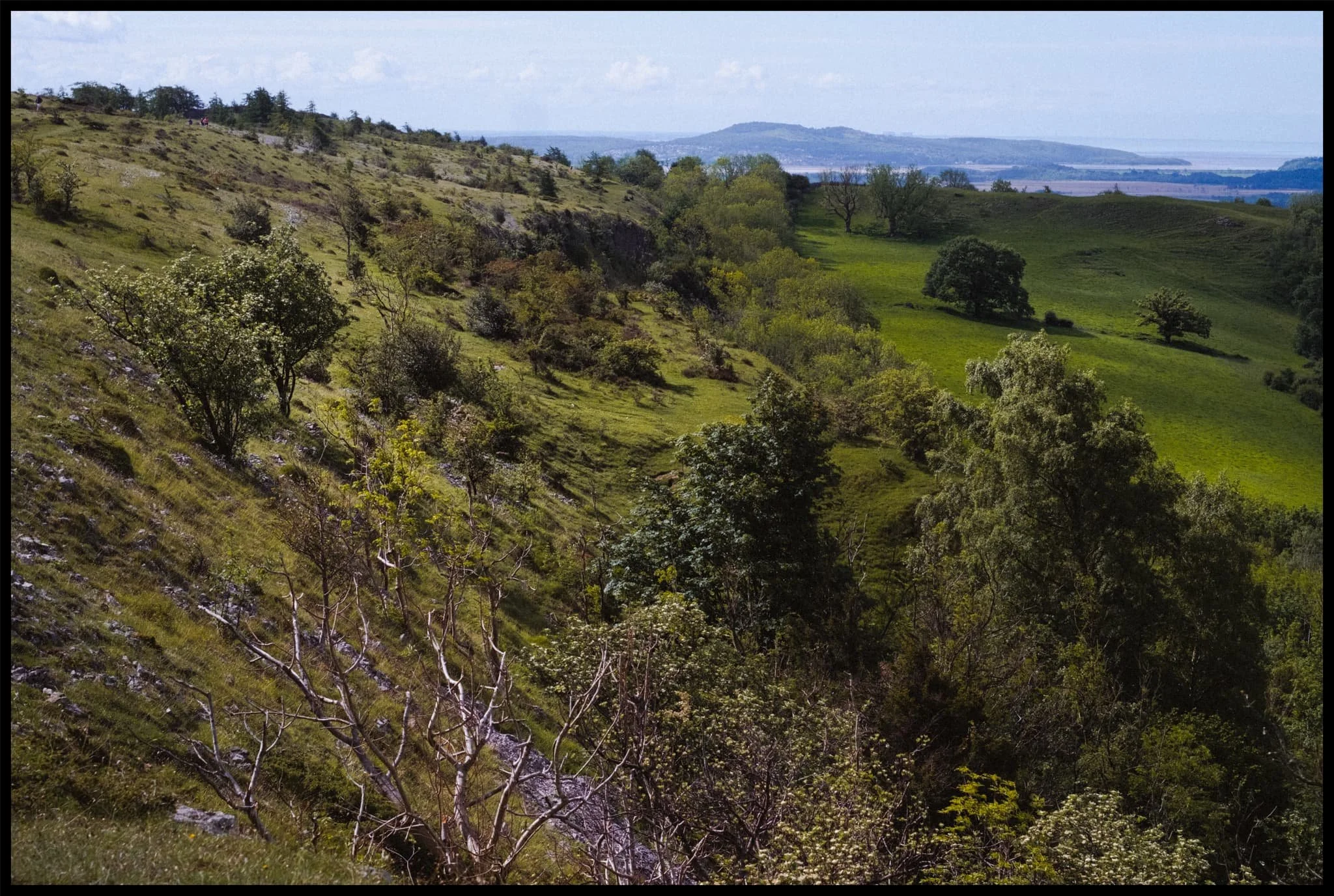  Looking back south. The atmosphere was so clear that we could easily make out the Kent Estuary, which leads out to  Morecambe Bay , with  Arnside Knott  above it. 