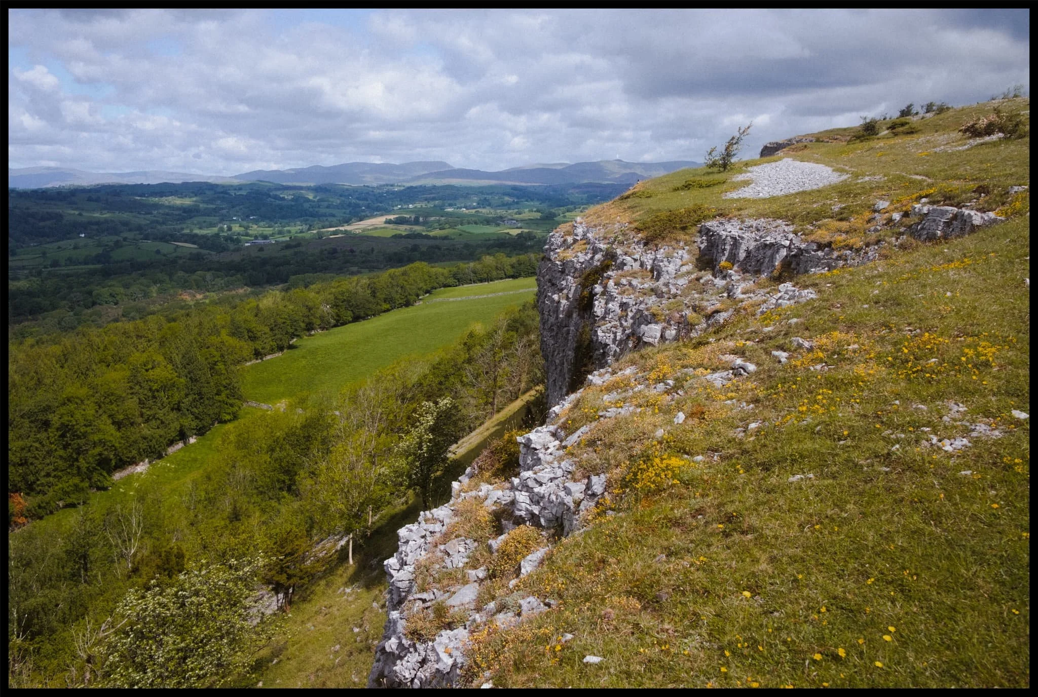  The  Kentmere  and Longsleddale fells using the limestone cliffs as a leading towards them. 