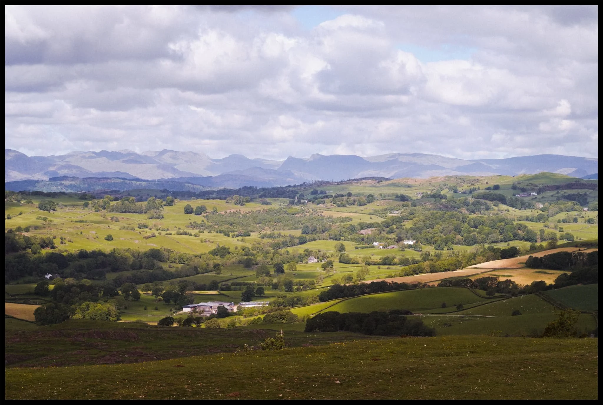  The Lake District fells, with the Langdale Pikes in the centre, shot from the summit of Scout Scar, which is crowned by the Mushroom shelter. 