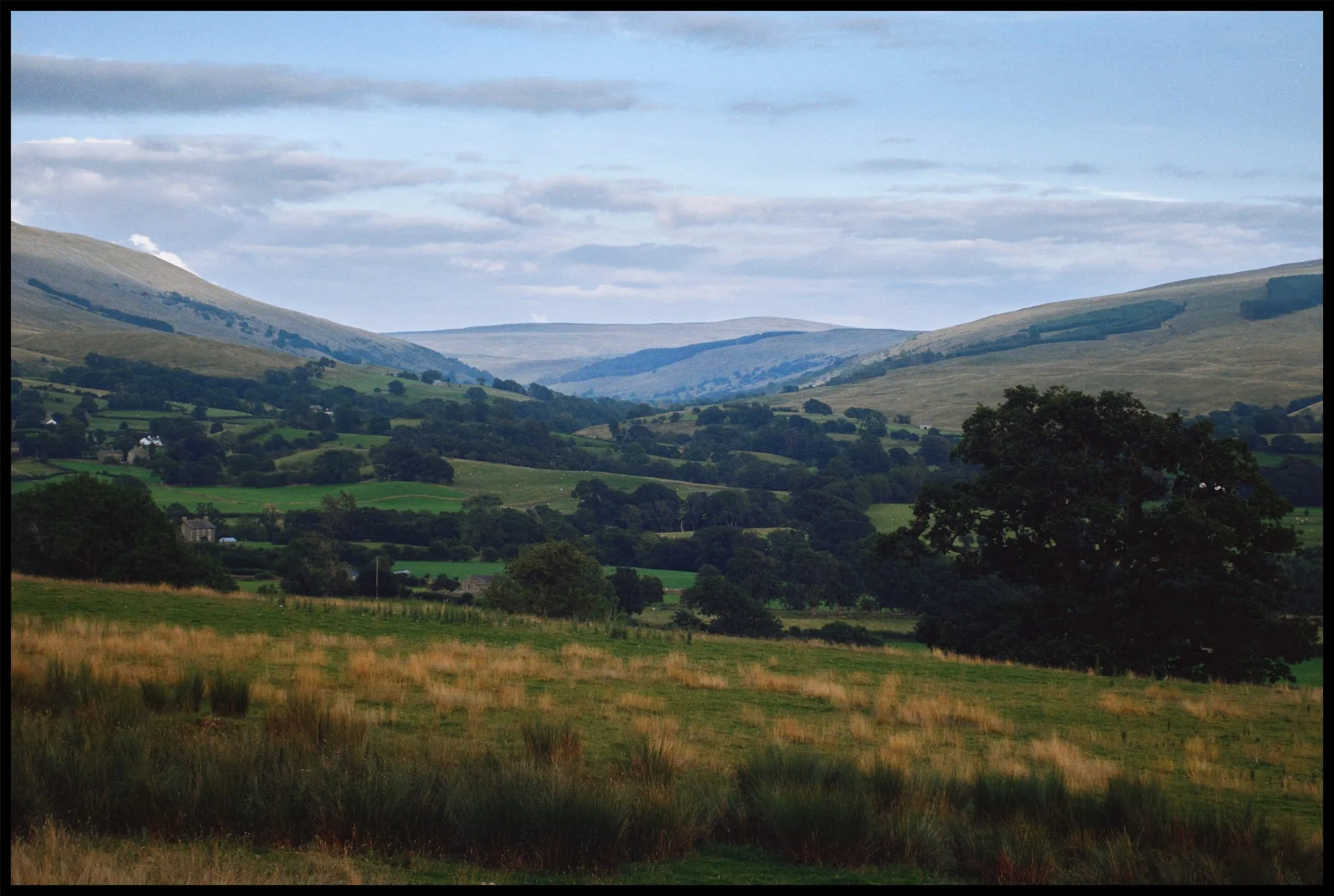  Beyond Castlehaw Lane and Howgill Barns, the track becomes little more than a vague depression across the fields. The views also open up tremendously, here showing a clear view towards Garsdale in the Yorkshire Dales. 