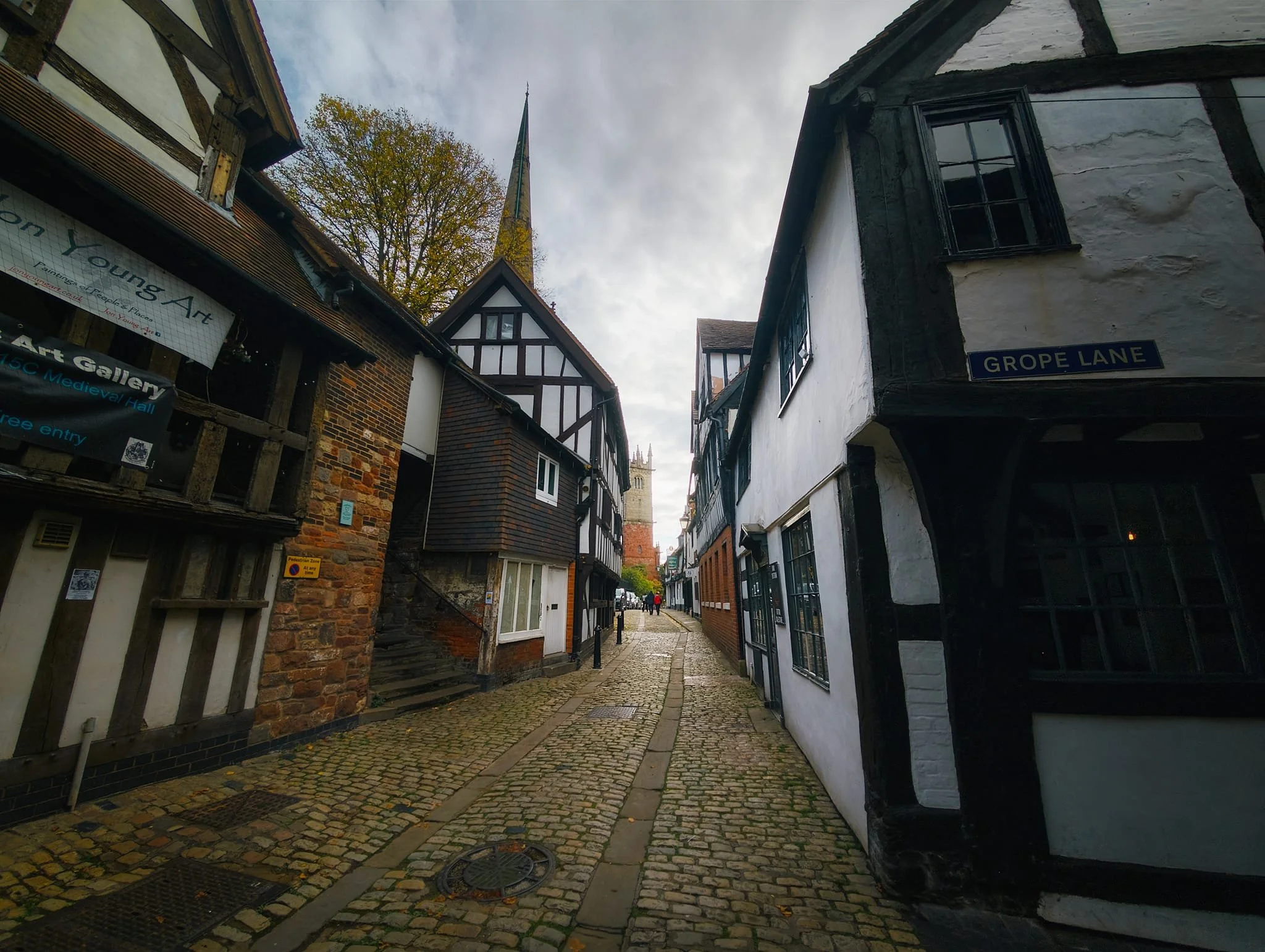 There are two theories for the origins of all the Grope or Gropecunt Lanes, one polite and one not. The polite version, certainly for Shrewsbury’s Grope Lane, is that the name was given because of the lane’s narrowness, which forced people to