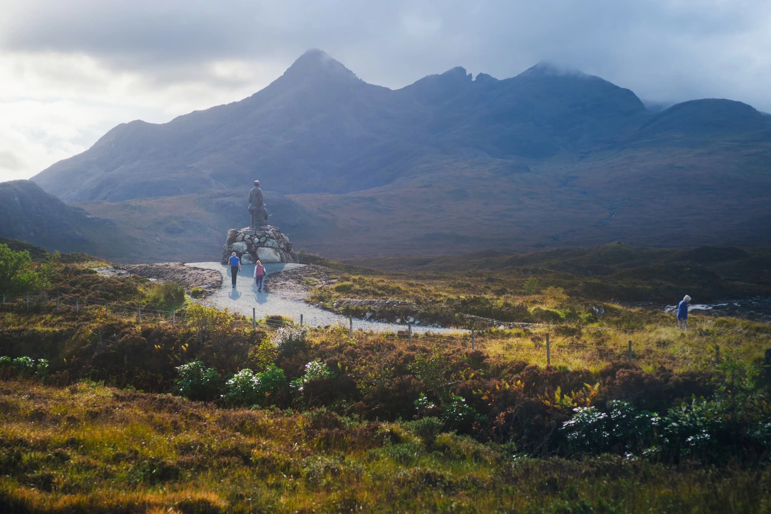 A more zoomed-in view of the beautiful Black Cuillins. A new statue, unveiled only this year in 2020, features two mountaineers (Prof. Norman Collie, a chemist, and John Mackenzie, a local crofter and mountain guide). They gaze at the Black Cuillins that they famously climbed all the peaks of, mapping out new climbing ascents.