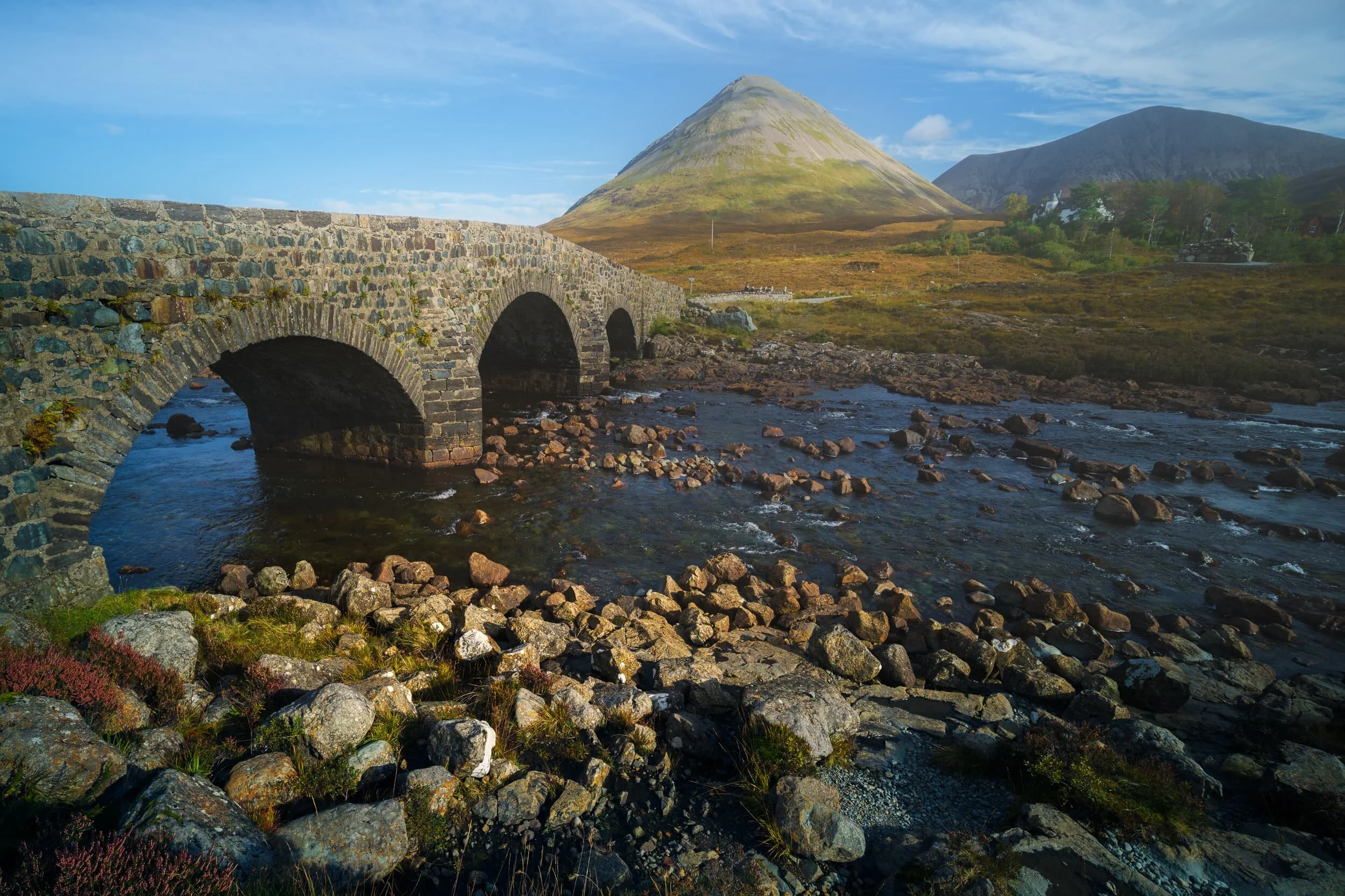 I’ve talked about, and photographed, the Black Cuillins a lot on Skye, but there is another mountain range located next door to them. They are the Red Cuillins. Whereas the Black Cuillins are jagged and craggy, owing to them primarily being composed of coarse and hard volcanic gabbro rock, the Red Cuillins a made of granite, resulting in smaller and smoother hills. Here I utilised the Old Sligachan Bridge has a leading line towards Glamaig (775 m/2,543 ft).