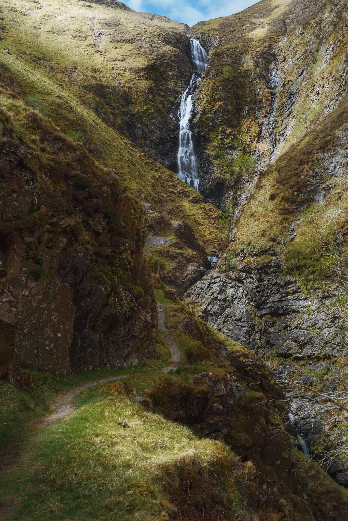  East from Moffat into Moffatdale the hills rise higher and higher as the valley closes in. Soon enough you&rsquo;ll arrive at Grey Mare&rsquo;s Tail Nature Reserve, which takes its name from the famous waterfall here, Grey Mare&rsquo;s Tail. The last time we hiked up the trail towards this waterfall was November 2015, nearly a decade ago. The light conditions this time were favourable, sculpting the deep gorge created by the UK&rsquo;s 5th highest waterfall, which drops 200 ft down. 