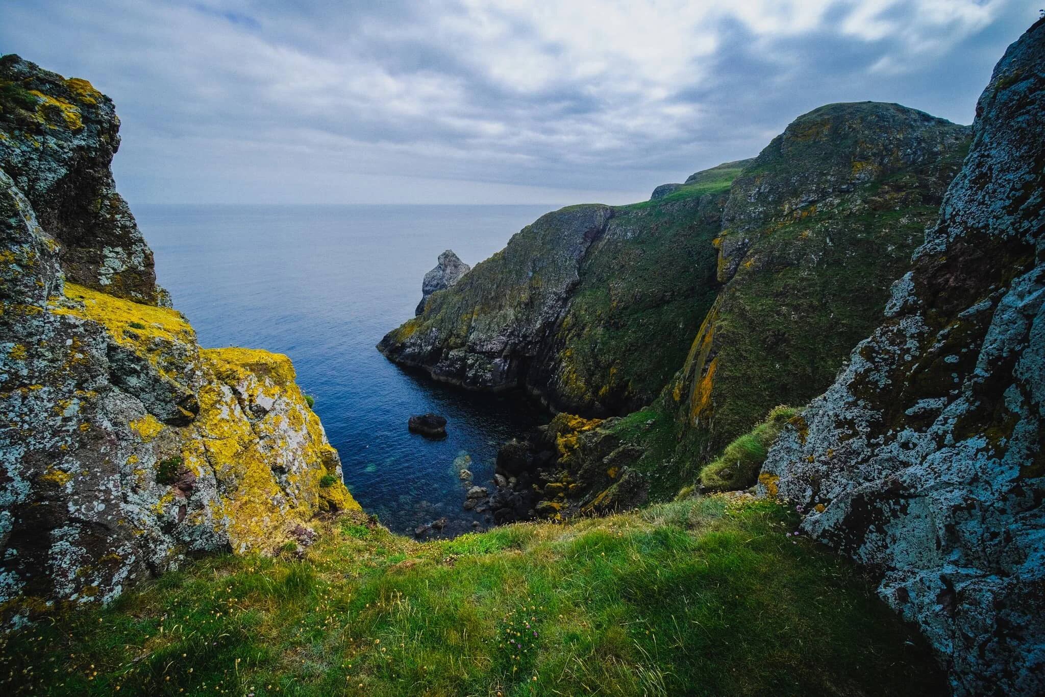  Lisabet and I find a grassy opening framed by two towers that provides me with this wonderful composition of St. Abb&rsquo;s Head and the North Sea beyond. 