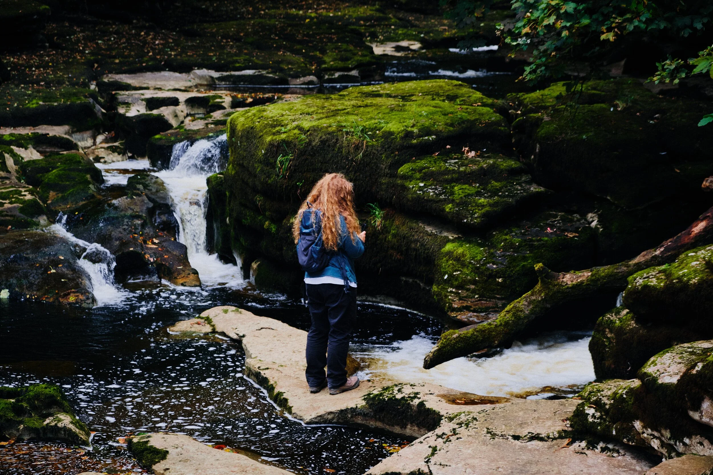 Lisabet hopping rocks to get a closer shot of some of the falls.