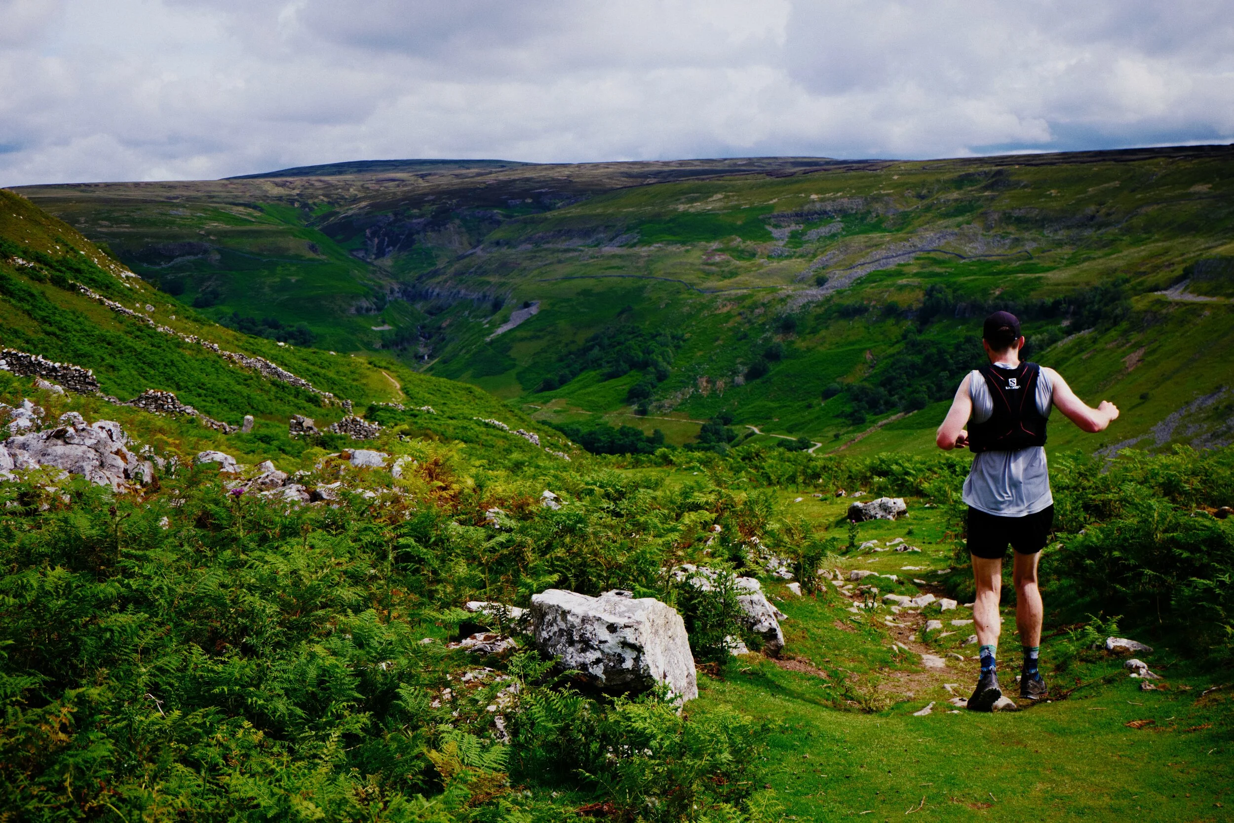 A fell runner navigates the Pennine Way towards Keld.