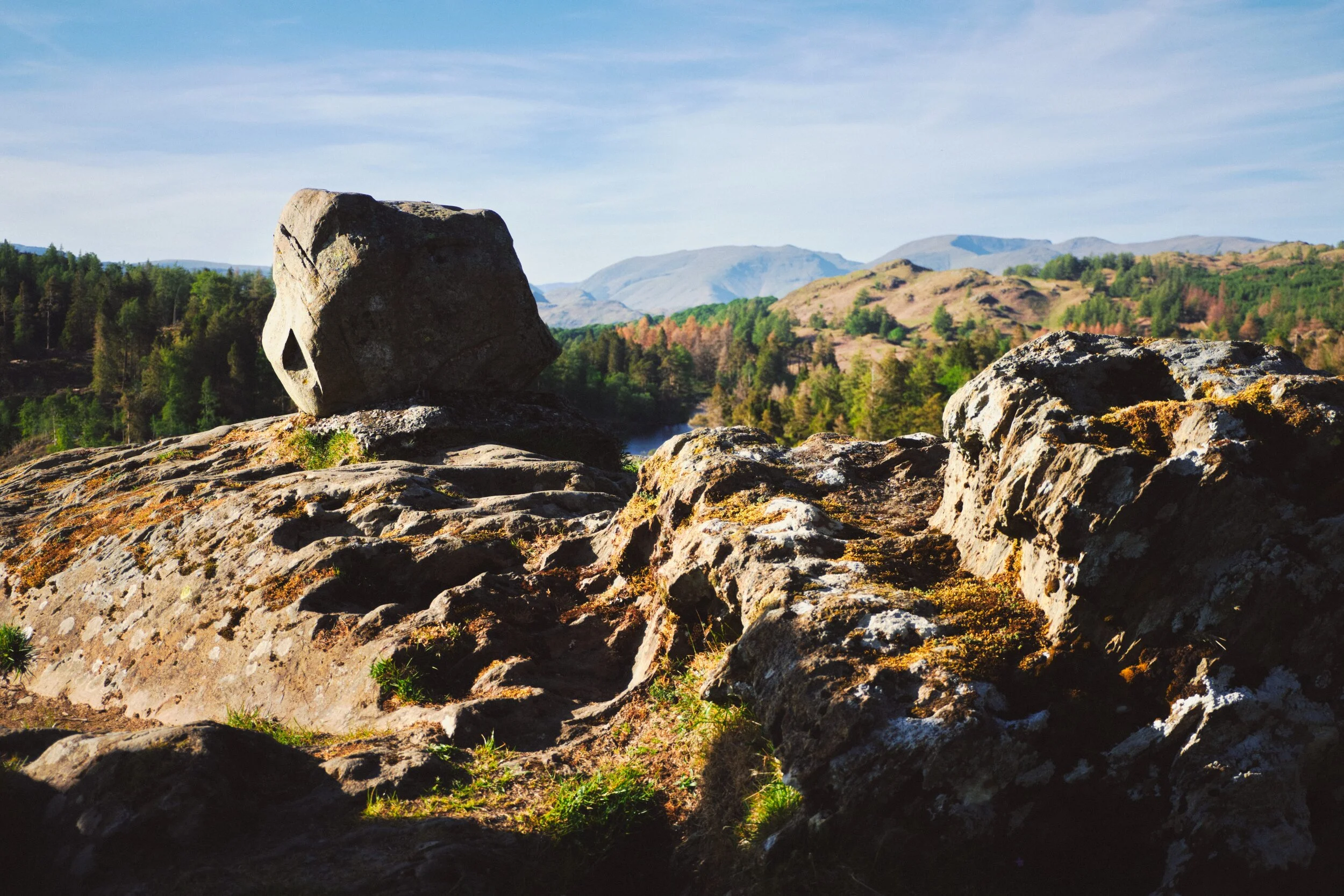 The highest of the rocky knotts southeast above Tarn Hows is home to this glacial erratic perched on its summit.