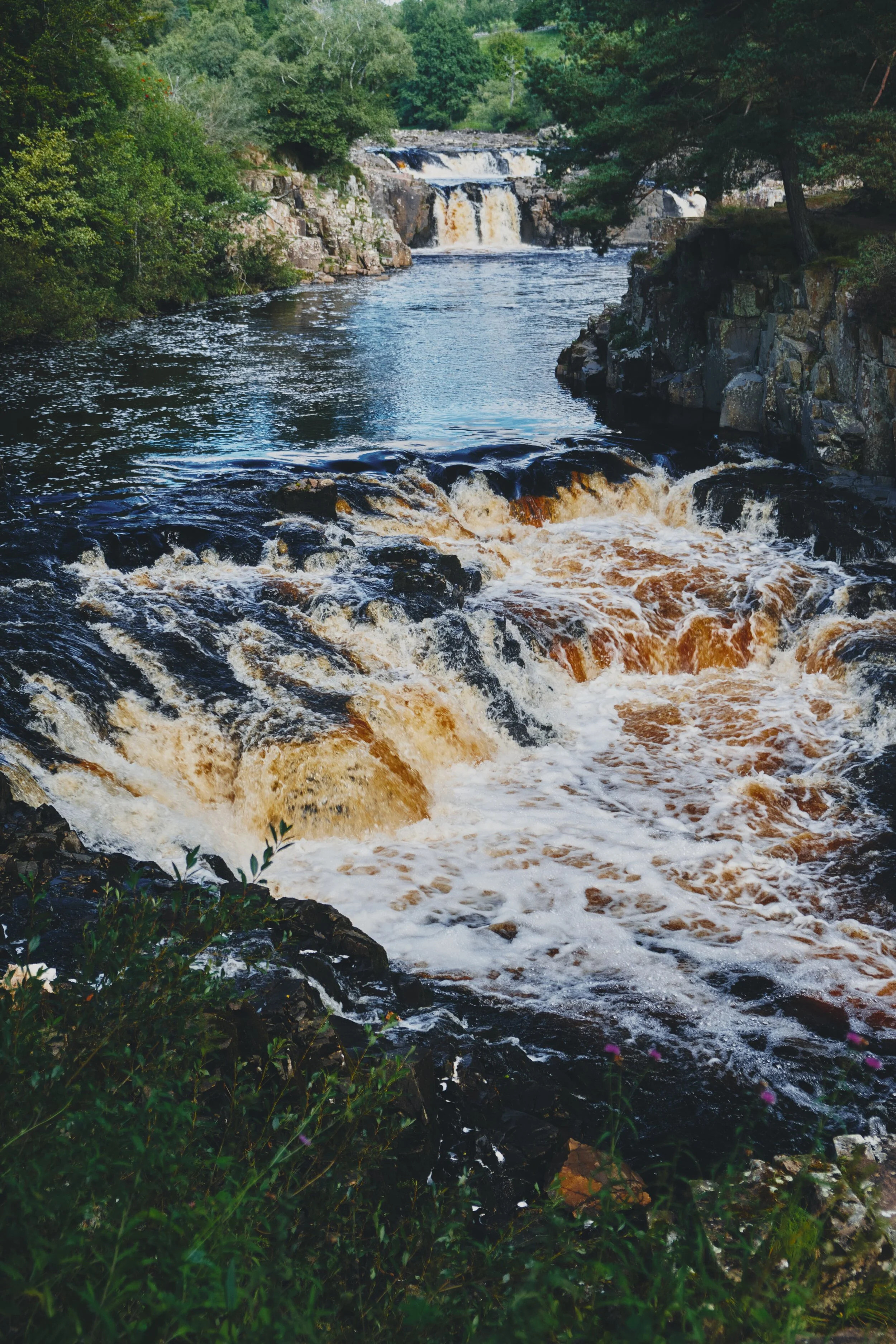  After crossing Wynch Bridge (carefully, it&rsquo;s a suspension bridge built in the 1830s), you can catch site of another set of cascades with Low Force in the distance. 