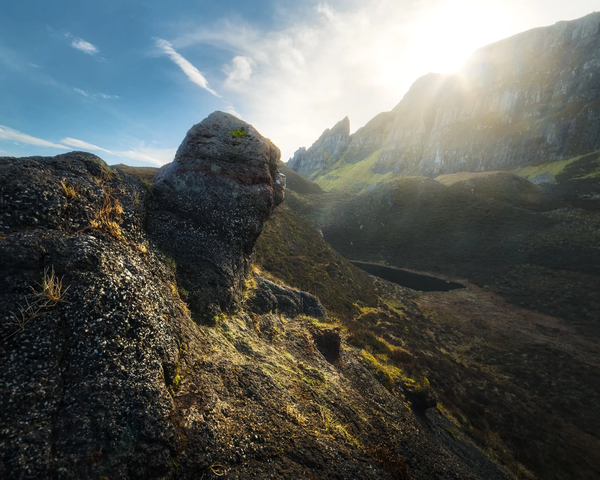  Above Loch Hasco and beneath the cliffs of  Meall na Suiramach , we took some rest and explored more fascinating rock formations. I found this weird nubbin of rock as the sun crested above the cliffs of the Quiraing. 