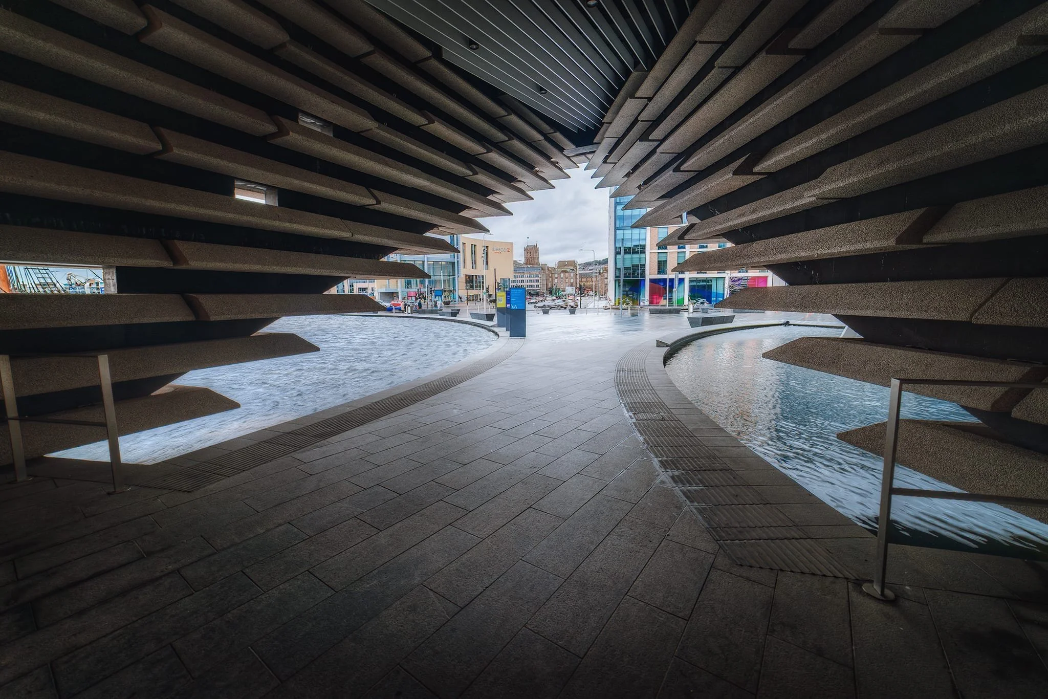  Taking shelter from the rain and using the building&rsquo;s design as a frame looking back to the city. 