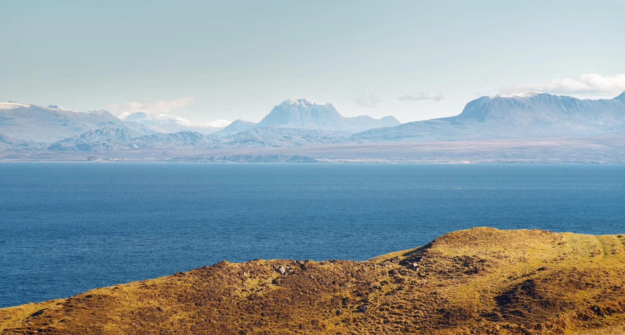  Further along the mainland, the unmistakable shape of Slioch (&ldquo;the spear&rdquo;), above Loch Maree, is immediately apparent, standing 3,219 ft above the sea. 