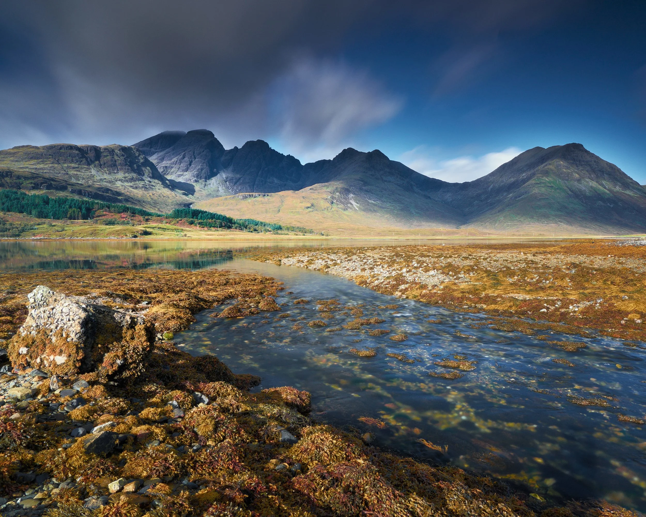 “Warm Light, Blue Mountain” by ian Cylkowski. A long exposure of Blàbheinn from the shores of Loch Slapin. Shot in 2016.