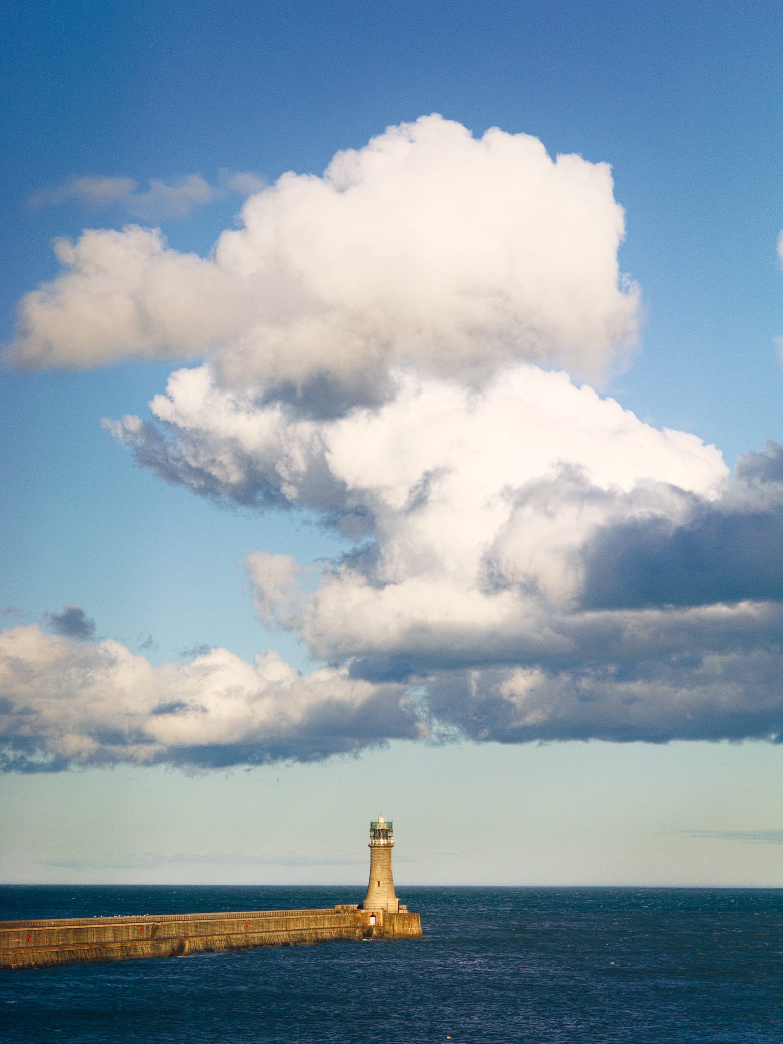 As the worst of Storm Dave cleared, we returned to Tynemouth proper later in the evening. This is Tynemouth&rsquo;s North Pier, which I zoomed into to isolate the lighthouse against the warm clouds above.