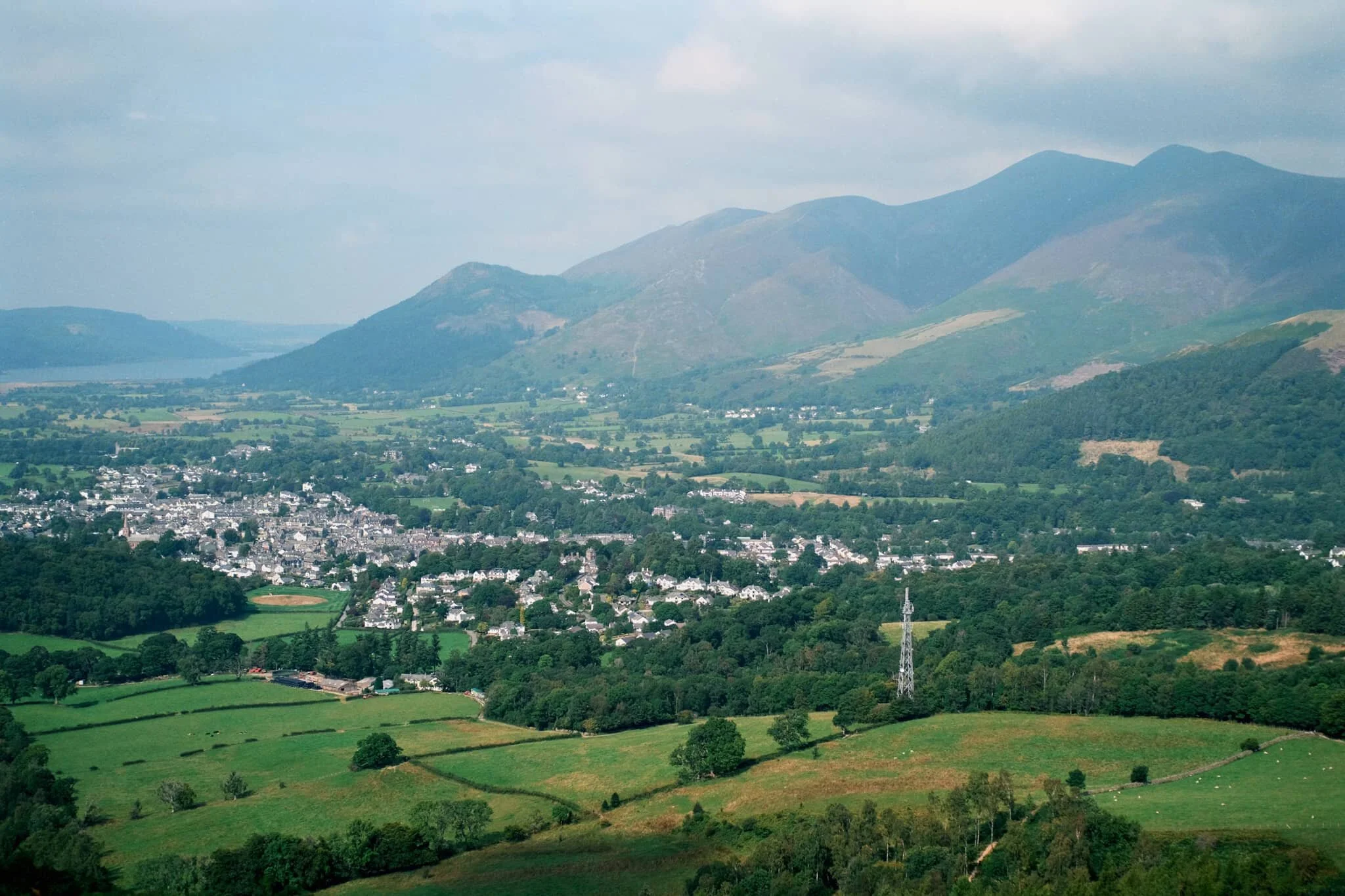  Skiddaw&rsquo;s multi-peak shape looms of the bonny town of Keswick. 
