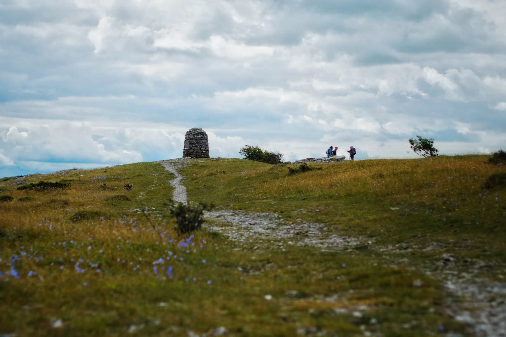 Approaching the wind-blasted summit and cairn of Lord’s Seat, which also serves as a signal to take a rest for water and a snack.