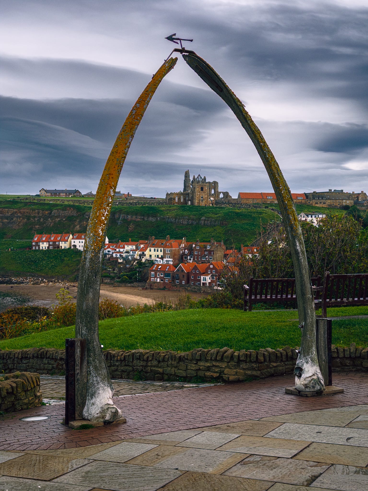 One of Whitby&rsquo;s most iconic features as you approach from the West Cliffs. An archway made from whale bones, to celebrate the town&rsquo;s whaling past, is used to frame the distant St Mary&rsquo;s Church and the ruins of Whitby Abbey behind it.