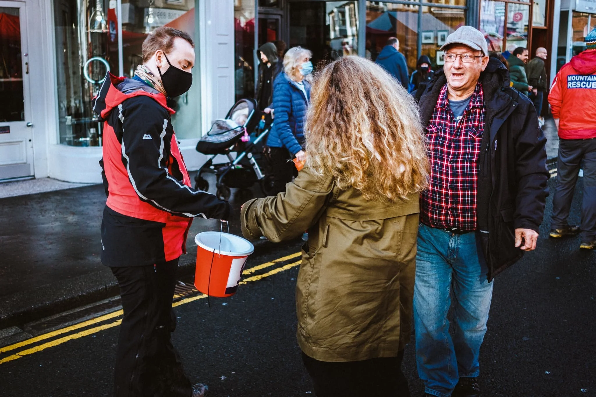  A little donation to Penrith Mountain Rescue as the drumming band passes. 