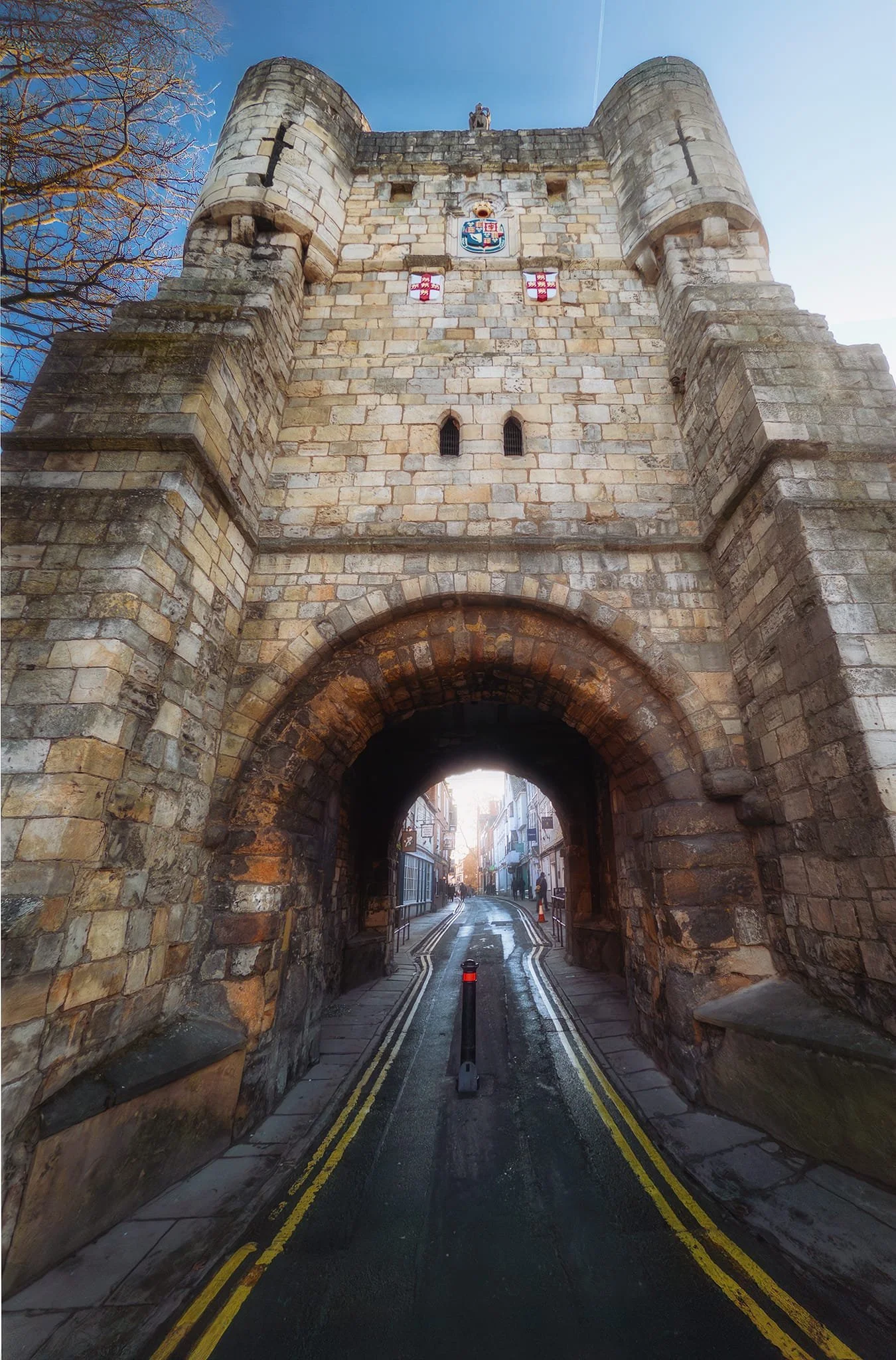  This gatehouse is Bootham Bar, one of four main &ldquo;bars&rdquo; that punctuate the ancient city walls of York. Though largely rebuilt in the 14th and 19th centuries, Bootham Bar retains 11th-century stonework, the oldest surviving. It stands near the site of the Roman northwest gate, taking its name from the 12th-century 